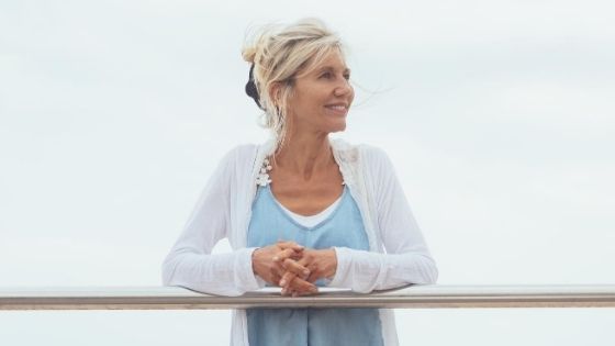 older woman looking out over the ocean