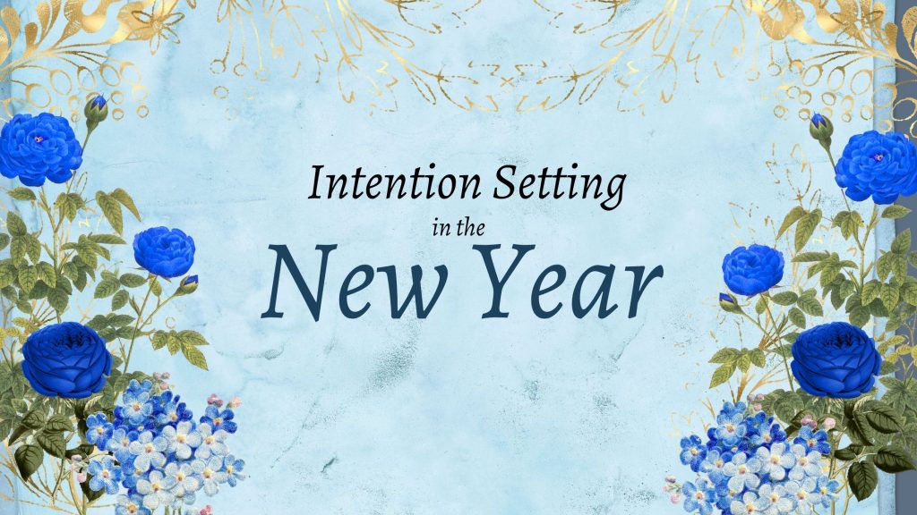 aqua background with blue floral border and text that says intention setting in the new year