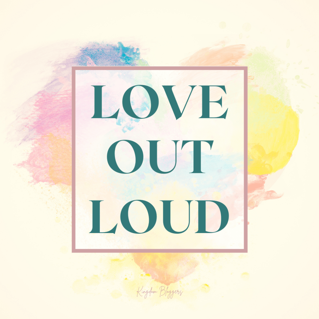love out loud on a yellow backdrop with pastel heart shape