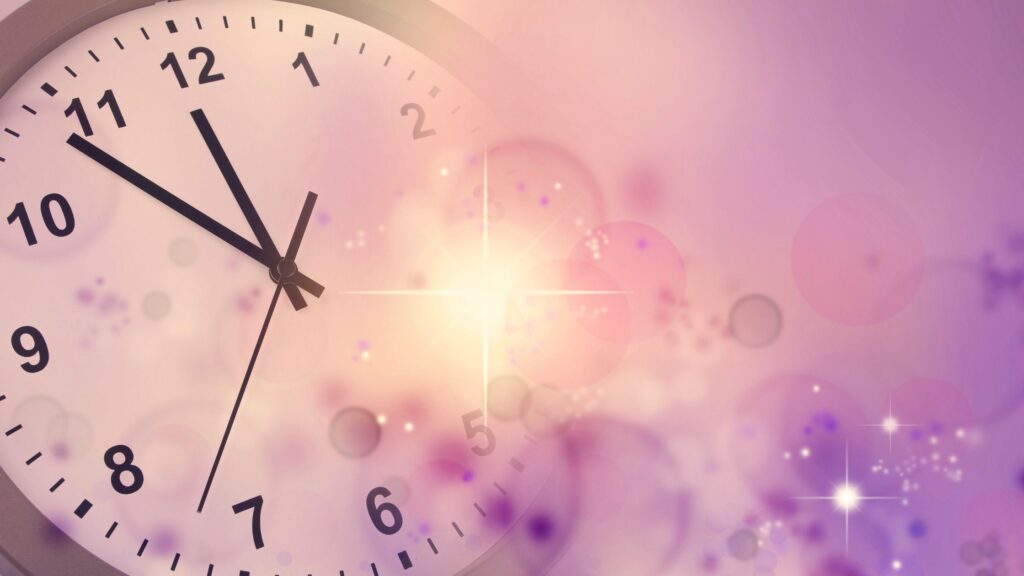 clock showing about five minutes to midnight with a glitter overlay