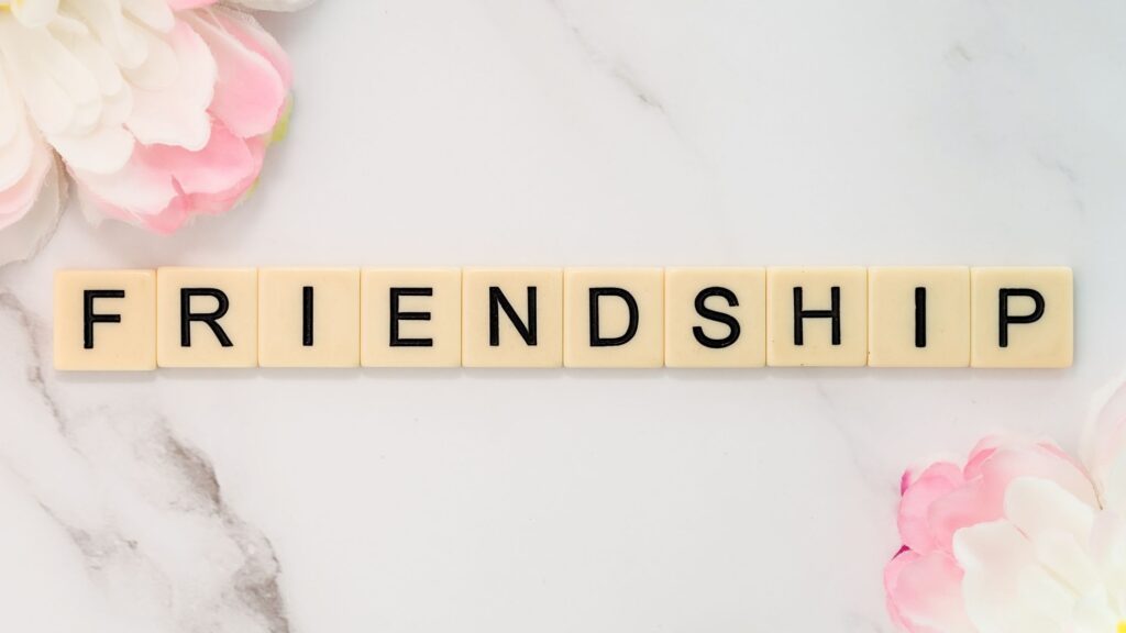 the word friendship spelled out with letter blocks